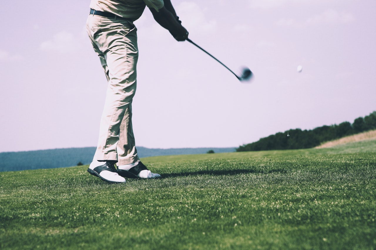 A man warming up for a game of golf