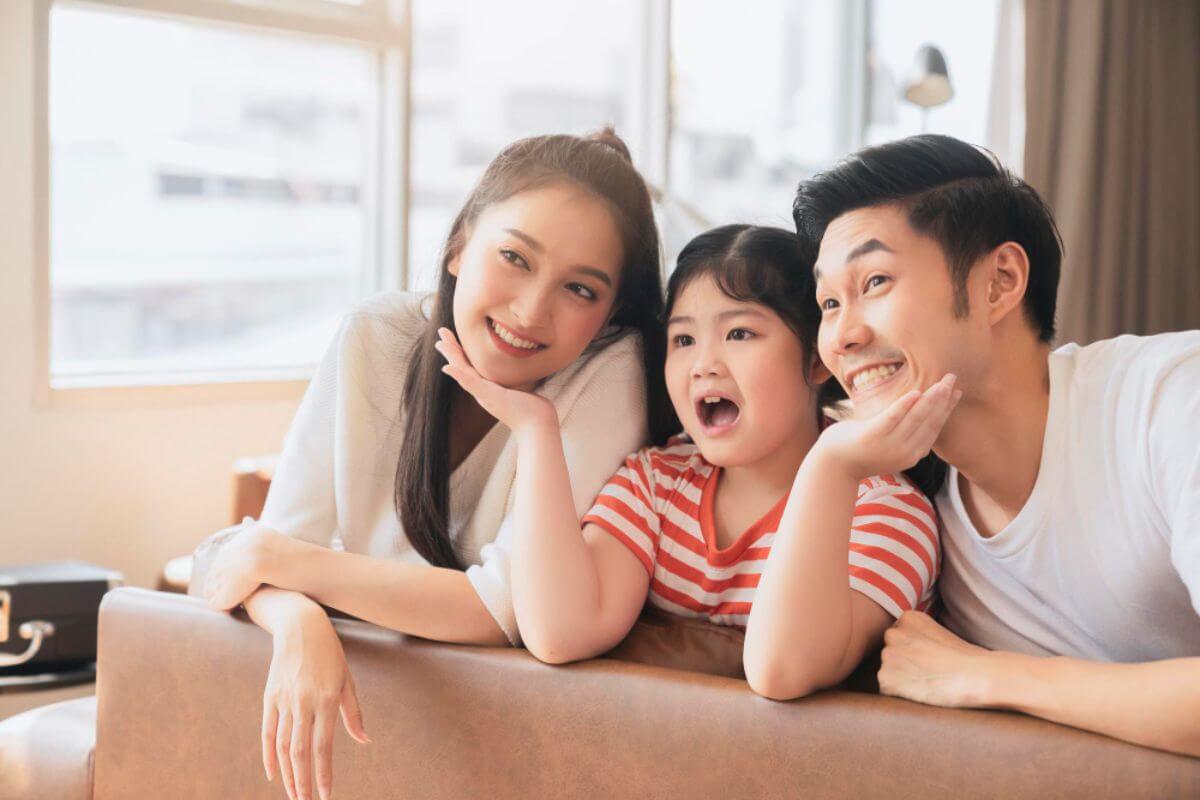 Asian family looking very pleased and happy with their new home in Cebu.