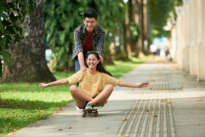 People enjoying an afternoon outdoors in a green, walkable community, reflecting the lifestyle at Pueblo de Oro Courtyards Lipa.