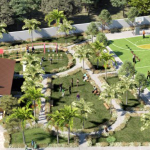 Amenities at Pueblo de Oro Townhomes Carcar featuring a modern clubhouse, basketball court, playground, and landscaped gardens.