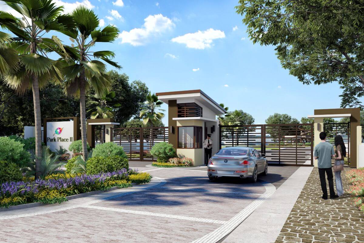 Secure gated subdivision entrance with landscaped surroundings in a master-planned residential development.